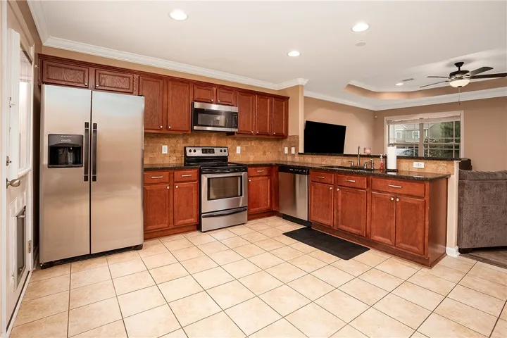 This spacious kitchen features ample cabinetry, generous counter space, and modern appliances for effortless living.