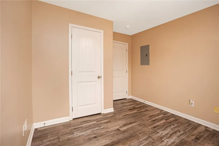 This versatile room features durable flooring and functional details, ready for customization.