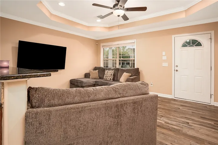This inviting living space features warm tones and ample natural light, perfect for relaxation and gatherings.