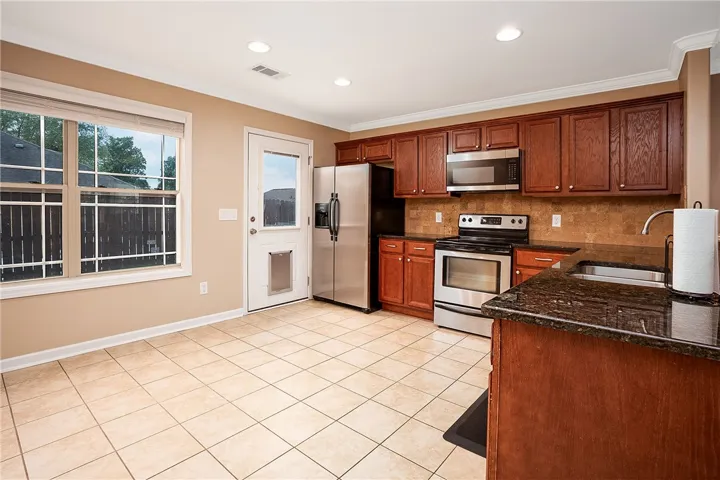 This spacious kitchen offers ample room for daily living and entertaining.