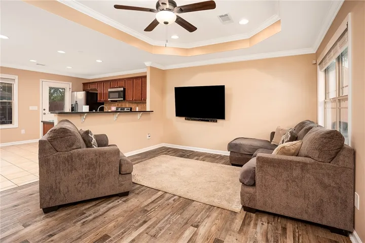 This inviting space combines comfort with practical design, perfect for daily living and entertaining.