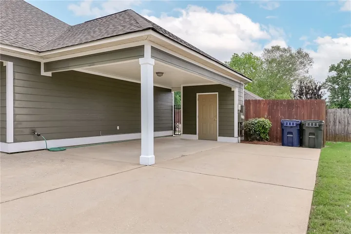 This residence features practical exterior amenities, offering both convenience and curb appeal.
