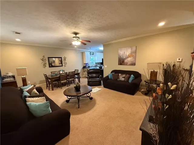 This inviting space combines comfort and functionality, perfect for daily living and entertaining.