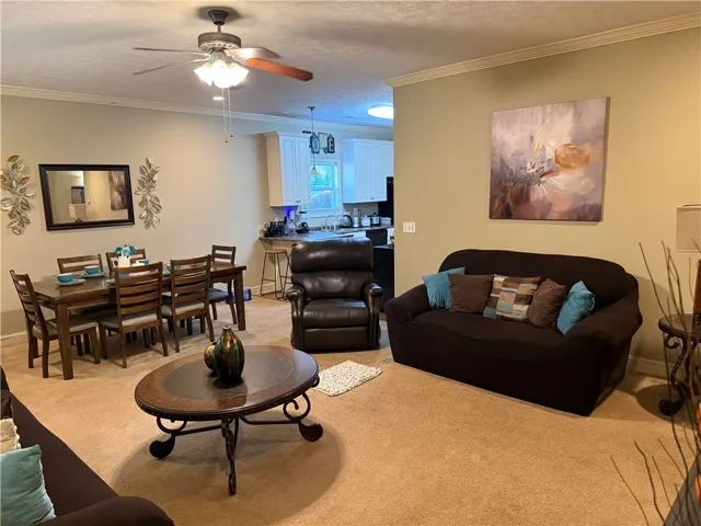 This inviting space combines a cozy living area with a functional dining room, perfect for everyday living.