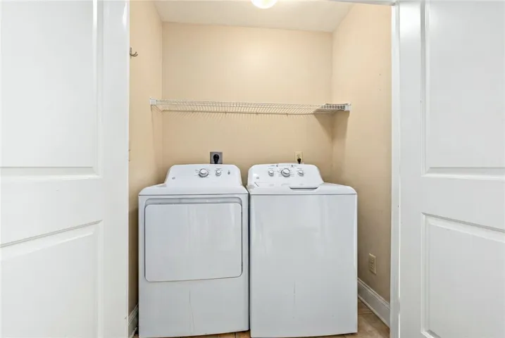 A dedicated laundry space, thoughtfully designed with functional appliances for daily routines.