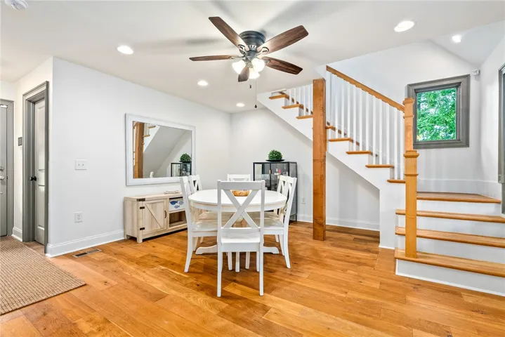 This inviting dining area features warm hardwood floors and abundant natural light.