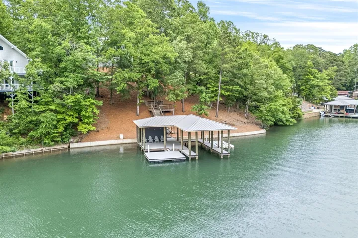 This tranquil waterfront property offers serene lake views and a private boat dock.