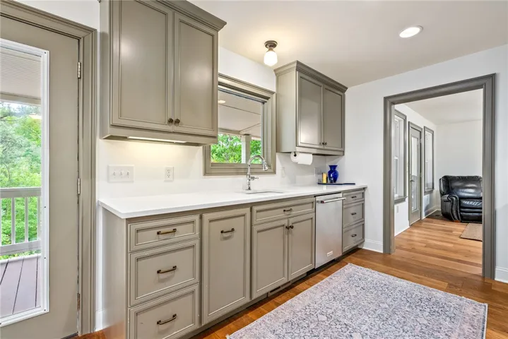 This bright kitchen features ample counter space and storage, perfect for culinary endeavors.