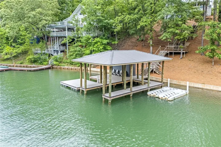 This serene lakefront property offers a private dock, perfect for enjoying the tranquil waters.