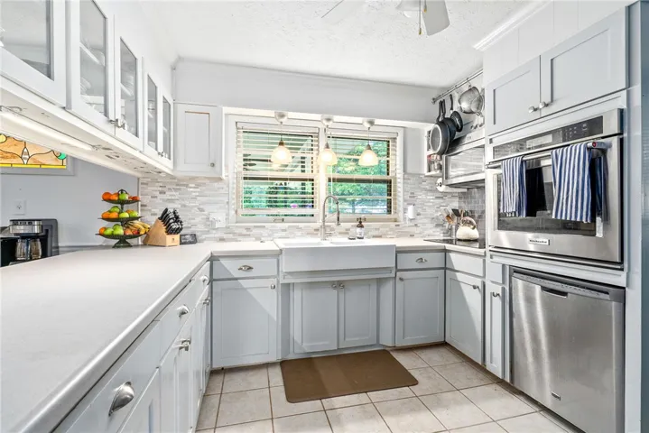 This bright kitchen features modern appliances and ample counter space.