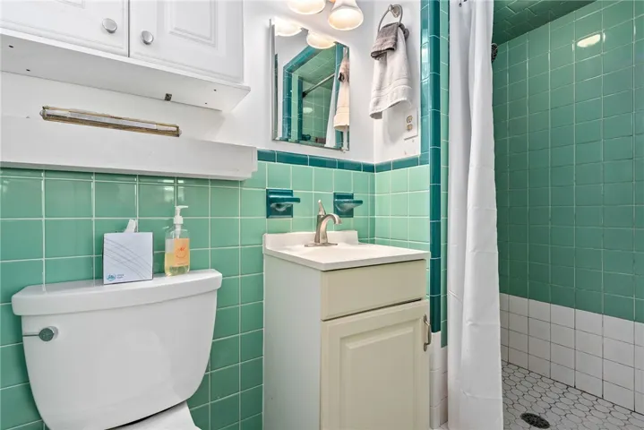 Bright bathroom features vibrant tilework