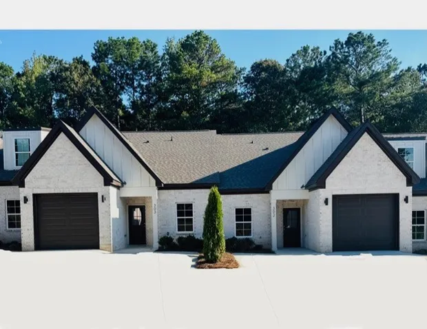 Example of completed ~This charming residence features an inviting exterior with attractive architectural details.