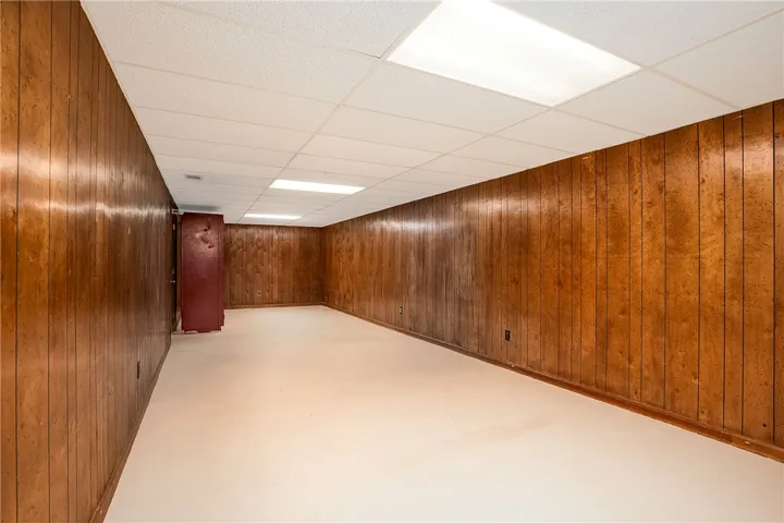 A spacious basement area offers an unfinished canvas for personalized recreation or additional living space.