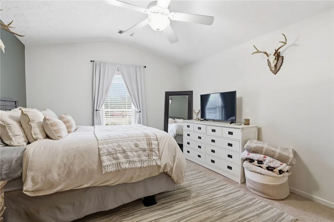 This tranquil primary bedroom offers comfort and a relaxed atmosphere.