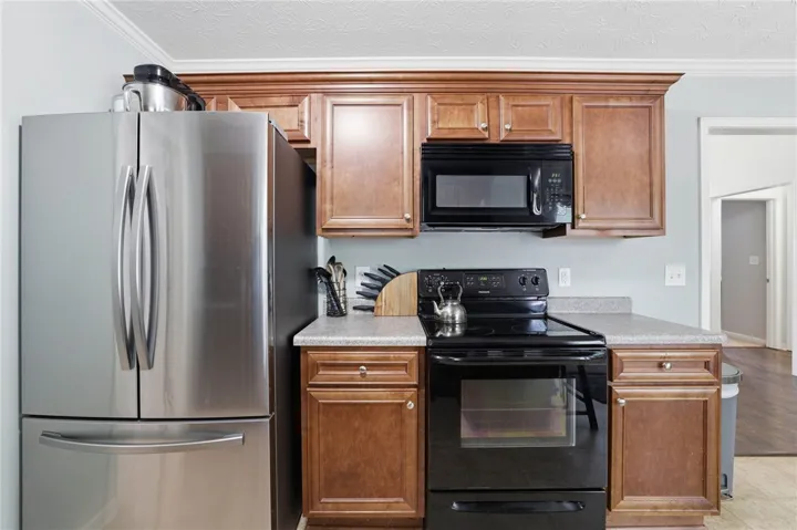 Functional kitchen with ample cabinetry for everyday culinary tasks.