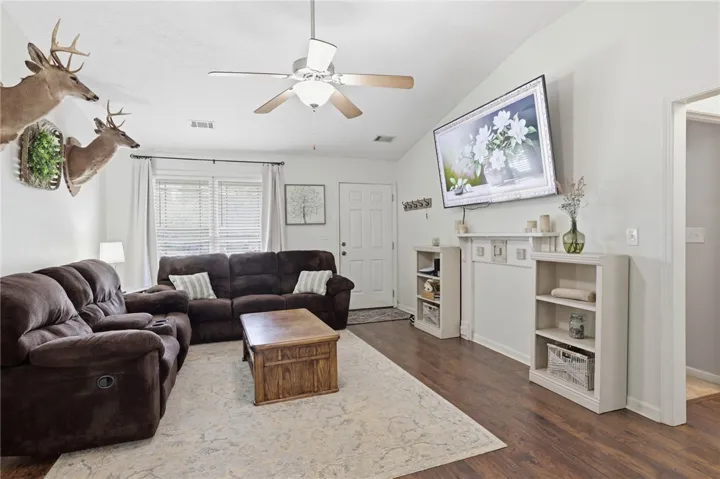 This living area features ample natural light from the large front window.