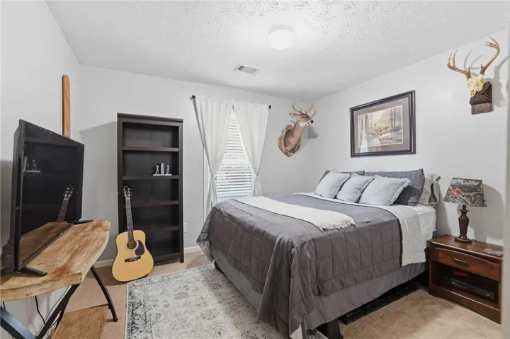 This naturally illuminated bedroom offers a calm retreat.