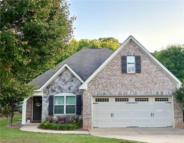 This charming residence features a well-maintained exterior and inviting curb appeal.