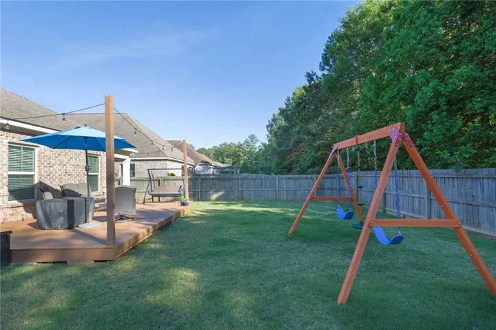 This outdoor space features a spacious deck, perfect for entertaining and relaxation.