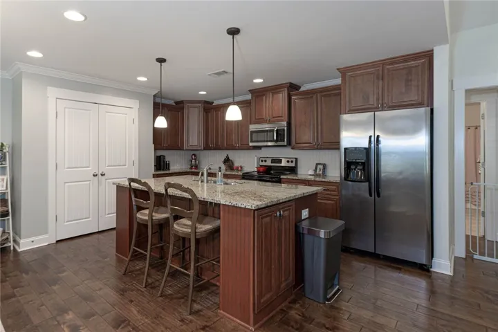 This functional kitchen features rich cabinetry, abundant counter space, and modern appliances.