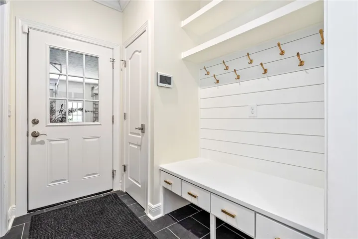 This entry offers functional built-in storage, perfect for organization and daily convenience.