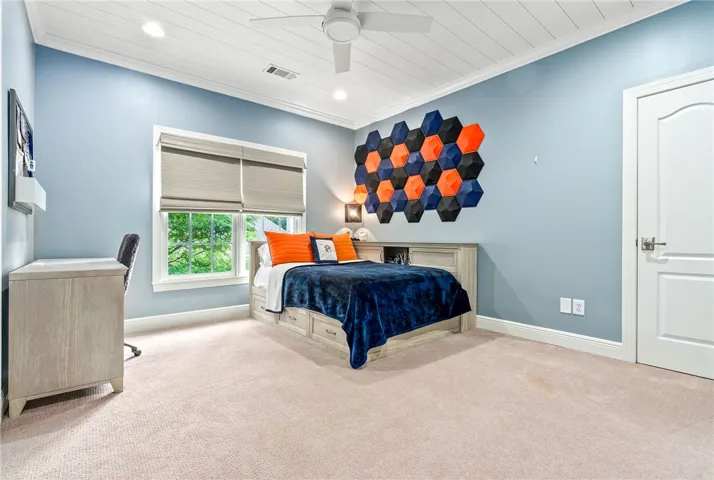 This spacious bedroom offers comfort and natural light.