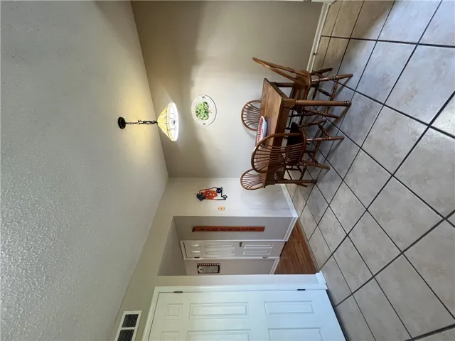 This cozy dining area features a warm ambiance, perfect for intimate meals and entertaining.