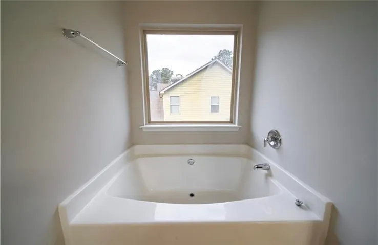 Relax and rejuvenate in this inviting bathroom featuring a soaking tub.