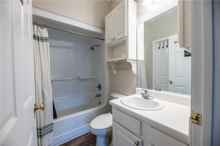 A well-maintained bathroom with a convenient tub and shower combination.