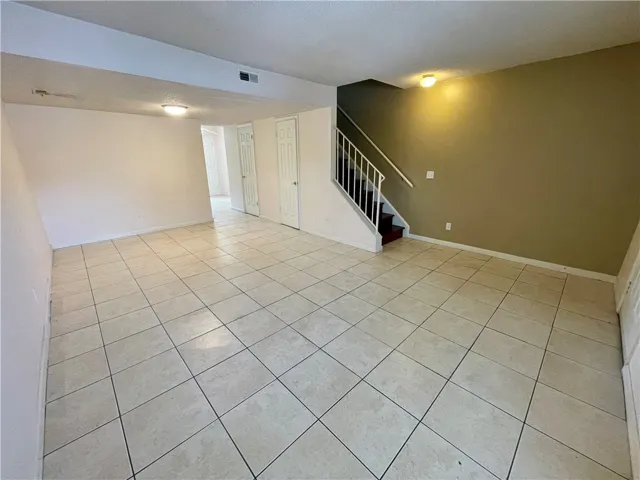 A spacious common area with durable tile flooring provides an excellent foundation for a variety of layouts.