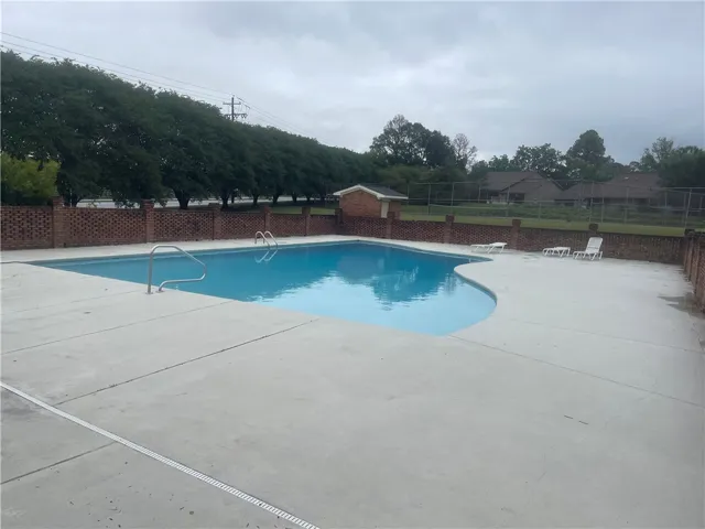 An inviting outdoor oasis features a refreshing pool, perfect for relaxation and recreation.