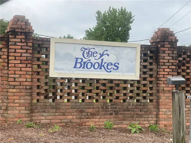 This brick community entrance sign provides a welcoming touch.