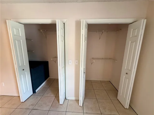 These two spacious closets offer practical storage solutions.