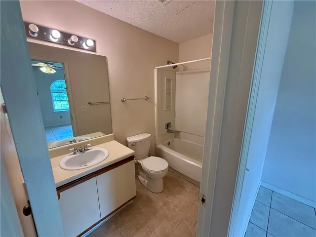 This clean and functional bathroom offers essential comfort and practicality.
