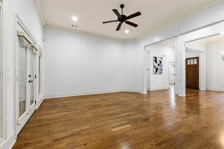 This expansive space features polished wood flooring and bright recessed lighting.