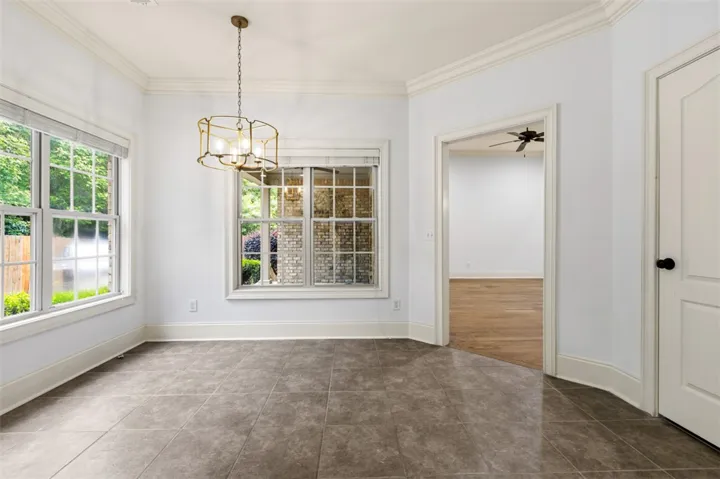 This bright space features ample natural light and elegant tile flooring.