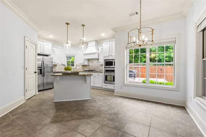 This bright kitchen offers a functional layout with direct outdoor access.