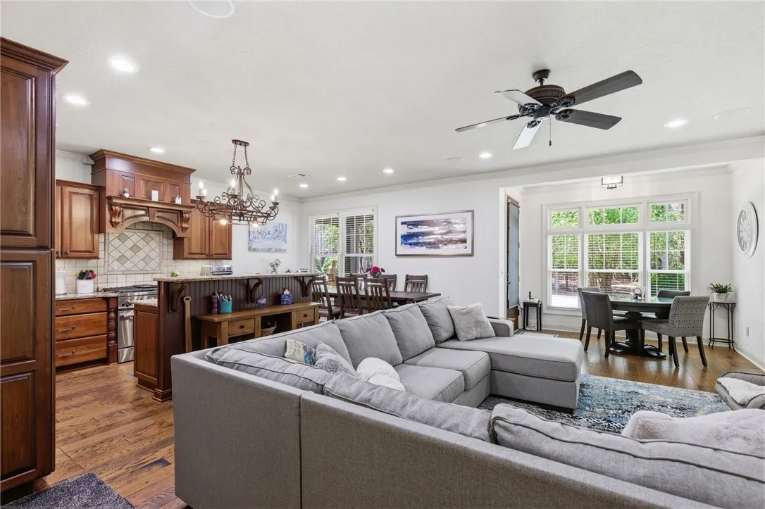 This inviting space combines a functional kitchen with a comfortable living and dining area.