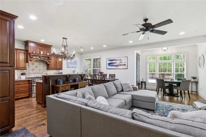 This inviting space combines a functional kitchen with a comfortable living and dining area.