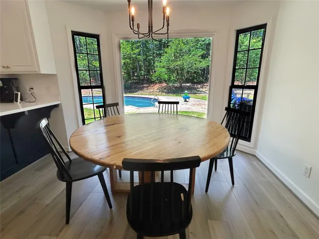 Enjoy poolside views from this bright dining area, perfect for daily meals.