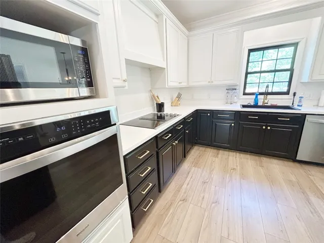 This culinary space blends sleek appliances with elegant finishes, ideal for any home chef.