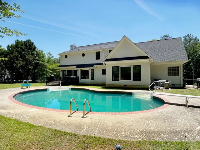 This spacious residence features a private pool, perfect for outdoor enjoyment and relaxation.