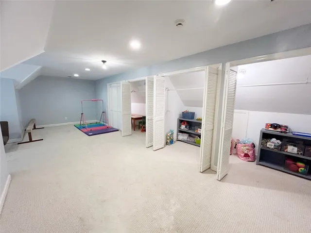 This spacious area offers versatility and comfort, perfect for various activities and storage.