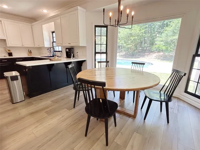 This bright kitchen with a breakfast bar provides ample space for entertaining and everyday living.