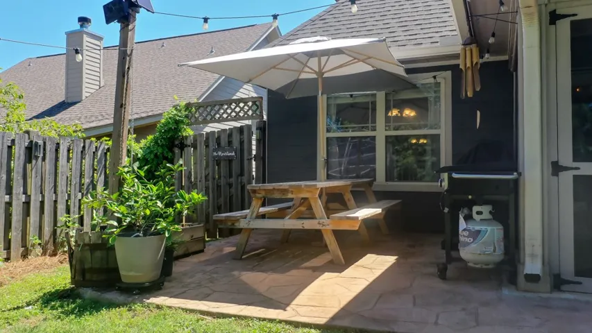 This private backyard oasis offers a serene escape with ample space for relaxation and entertaining.