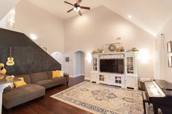 This living area features rich hardwood floors and an inviting atmosphere perfect for gatherings.