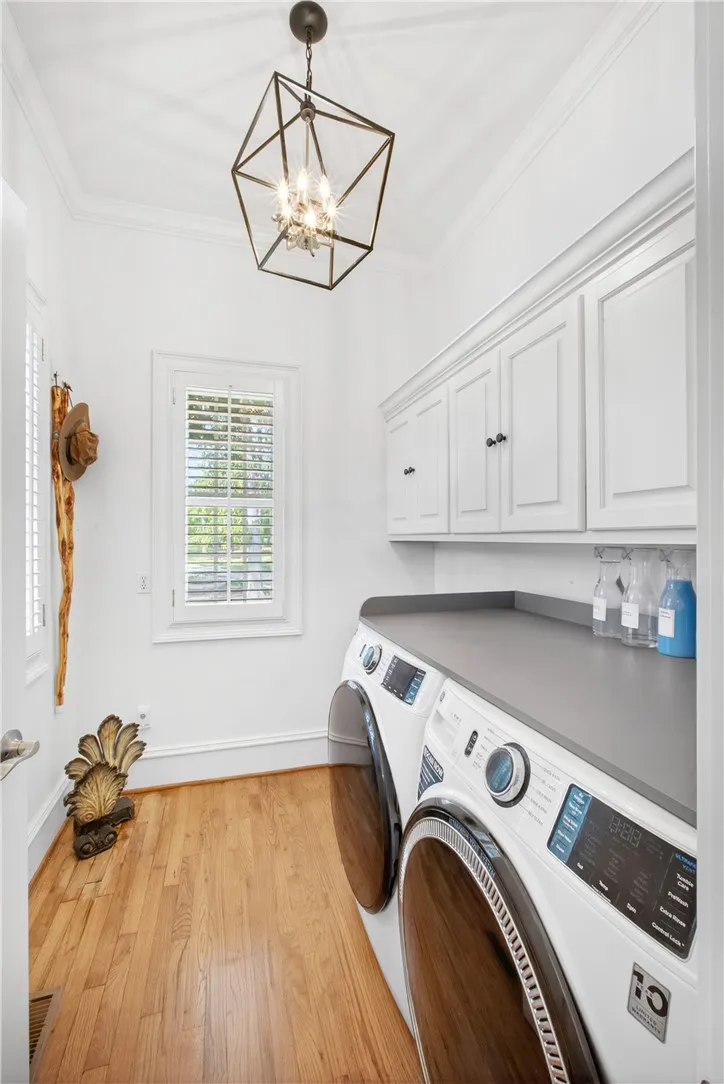 This dedicated utility space features convenient appliances and ample storage for a seamless routine.