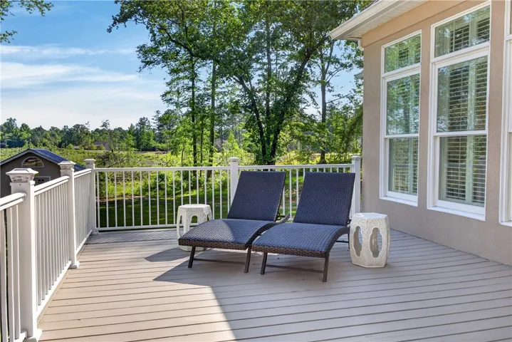 This inviting outdoor space offers a perfect retreat with expansive natural surroundings and abundant sunlight.