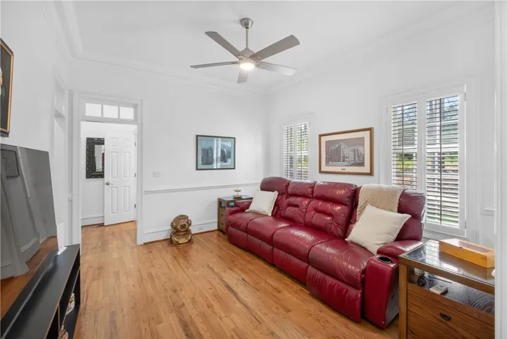 This area has had doors installed making it a true bedroom. Currently being used as a den. It features rich hardwood flooring and bright windows for abundant natural light.
