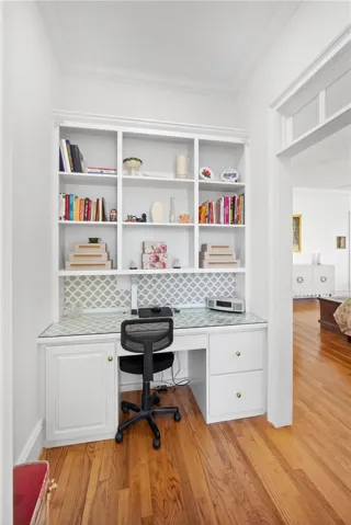 This dedicated workspace offers integrated shelving and abundant natural light for focused productivity.
